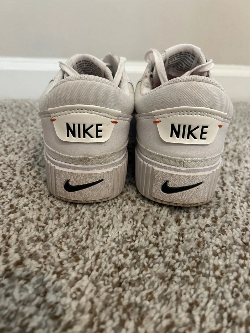 Nike Men’s White Sneakers with Red Swoosh and Leopard Tongue Detail